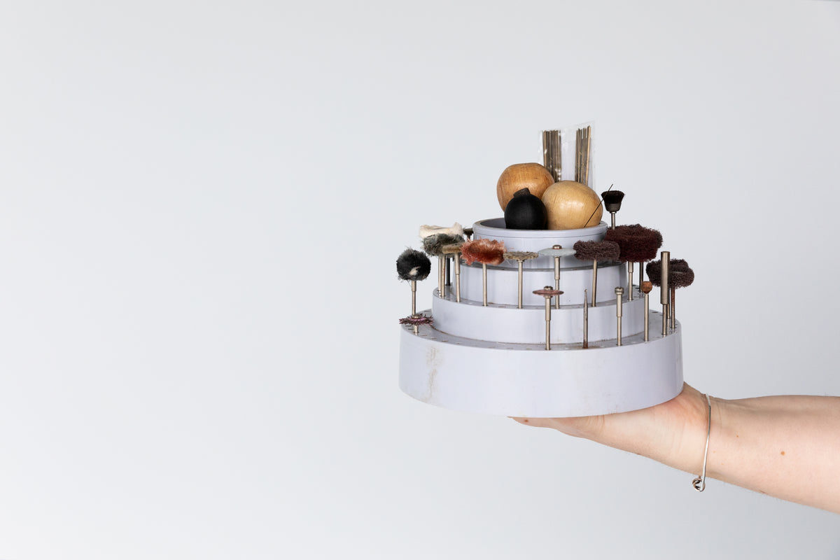 Small burrs and setting tools standing in a holder